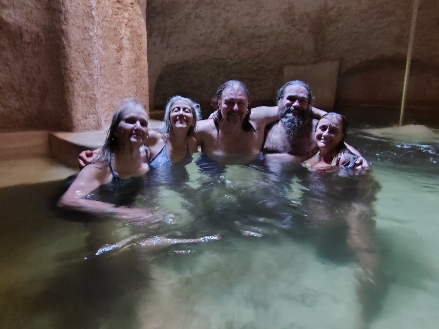 a picture of Dona, Beth, Diego, Sundance and Jiva swimming together in the Cenote cave under Hotel Zentik.