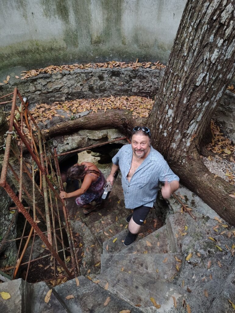 A picture of Deigo going down into David's Cenote